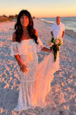 I'm 58 and renewed my vows on the beach. Dress was a medium and a perfect fit and looked fantastic for a beach wedding. - Janel B.