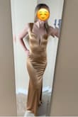 This dress is nice material and flattering, however its more of a bronze, darker shade of gold than the light gold on the model. Im wearing an XS. - Amy J.