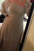 Was so surprisingly happy with this dress! It highlights my curves and hides the belly! No stretch, but doesnt feel restrictive! If wearing shape wear, it cant be too long on the thighs or it will show on the side of the slit. This pic is without any shape wear, even smoother with shape wear. Also the dress is more of a lavender color than grey in my opinion, but I almost love that more ? Love it - Lauren G.