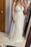 Amazing material, but very long, even with heels! I'm 5,3 and was tripping over all the fabric laying on the floor. I wasn't looking to invest in alterations with the price already being over $100 so I'm sending it back. I am barefoot in the photo. - Sara N.