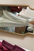 Using this as my wedding dress and it's stunning! The material is not cheap looking and the dress is a little heavy but in a good way. Only problem was it is very long so I had to hem it - Avalon M.