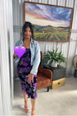 I bought this dress in purple. It's a beautiful dress that I wore to a winery. The fit of the dress ran too small so the dress fitted very tight. I couldn't zip the dress because I had a zipper issue. Don't think it was due to my size. Anyways, overall, I enjoyed wearing this dress. - Angela R.