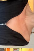 This top doesn't have the deep v photographed on the model. It has a kind of reverse sweetheart neckline that I dislike. The flaps of the neckline roll down upon trying on. This item is not returnable. I wish it was, Id never keep it! Going to goodwill. - Naomi R.