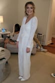 This was stunning on and perfect for my engagement party!! I had to get the legs and arm length hemmed. I also had to get the v-neck sewn because it was super low at first. After alterations, it was exactly what I wanted. - Courtney W.