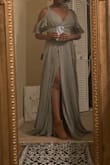 This dress is a beautiful wrap dress but it's a little too long for me. I would have to wear heels higher than 3.75" to get the hem of the dress a little more off the ground. There's a bit of drag. But I love how comfortable it is. It's a great quality dress and the color looks great on me! - Ngaio W.
