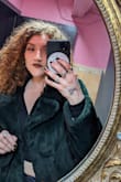 I've had this coat for two years now and it has been worth every single penny. The color, fit, and feel are all incredible. I live somewhere with cold winters and this coat is absolutely fashionable AND functional.
Also someone noted that it wasn't true to the color, but I did not have that problem. Emerald green is a darker shade for faux fur, but it absolutely shows up as that shade under light. - Brigid W.