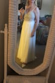 I love this dress. The rhinestone/pearl combo is beautiful and the fit is perfect. I got an 8 & 10 and chose to keep the 10 and altered it in a bit. Easy to wear and and elegant! - Molly H.