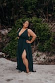 When I first got it, I couldn't zipper it completely up. I'm actually a G bust, but Lulus doesn't have that option to scroll to. I'm 5'5", 204lbs in the photo and a 36 right under my chest. I was able to lose 5lbs and also zippered it at my waist before putting my arms in, which helped it fit. I had to use a doubled up tape bra, but the green was perfect for my skin tone. The side openings were a lot of skin, for my comfort, but otherwise, it's a fabulous dress, if you're ok with the cleavage, which I have a lot of. The material is quality and it actually cleaned well after going into the ocean with it! - Julliette L.