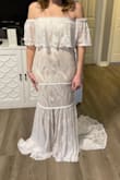 This dress is perfect. It only needed the slightest of alterations around the arms being a tad too big. I feel absolutely beautiful and for the price, I couldn't have found a more perfect dress for my big day. It does have a beige liner which makes it more of a beige and white dress but it matches the groom's attire so well. - Danielle D.