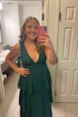 Loved this dress and the color, lots of compliments. But be aware that your girlies will be out and you have to tape them or use a sticky bra that doesn't show in the V-Neck area, also it was pretty snug so if you're in between sizes size up :) - Lindsay H.