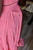 The zipper in the back bunched up and left a visible bump. See photos. I will be returning this. The dress was also very long for a short person, but that is easily tailored. Very unfortunate because the color was beautiful. - Anwesa C.