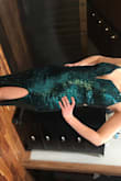 This dress was a showstopper at a recent gala. It was a little large in the bust for me, as I don't have much there but a little dress tape helped out, plus there is a small amount of padding so no bra or nipple covers needed! Form fitting through hips and waist. Got so many compliments!! - Kara C.