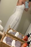 This dress fit absolutely perfect. After reading previous reviews, I went with the XS. The dress fit perfectly, not too tight but just right. Snug enough to feel secure. I love this dress and cannot wait for wear it for my wedding. - Candice C.