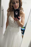 The material feels lovely, the dress is not transparent at all, and it is really beautiful in real life.
However, I listened to the majority of the comments here claiming the dress is too small and consulted with the costumer service (there is a specific size table for this dress, ask for it!). I was so scared it would be too small I ordered size 6, which is way too big for my measurements, especially the top part (the bottom is also long but I'm a shorty). I will need to do some alterations, which is completely fine by me. Overall I really love it! The kind and helpful costumer service, the fast shipping to Israel and the wonderful packaging are definitely a nice bonus. - Shira L.