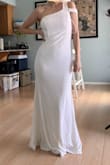 I like this dress for my courthouse wedding. It's simple, and modest. The shoulder detail is very cute. The pictures are fresh out of the package, it looks a lot better when steamed but I forgot to take a picture of that. With this type of fabric, you either want to wear shape-wear underneath or be aware that everything shows, as you can tell from the pictures. It works fine without a bra for me but some pasties will be good as it's cold here.
The length is good, I'm just in socks in the pictures, so a few inch heels will serve the purpose.
I am keeping this, but you definitely need to be aware that this is not a high-quality dress. You get what you paid for. - Kim S.