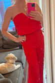 Really love this jumpsuit. I never wear red. Just need to have the seem fixed...I put it on and saw something silver poking out - looks like the boning maybe? Anyway, gorgeous. - Traci S.
