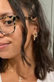 Classic gold hoops. They are a bit heavy but I added one of those small rubber earring backs to secure them in place (before the earrings clasp shut), and it worked perfectly. - Jessica T.