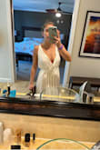 I read other reviews and sized down to an XS, I personally feel like this looks like a toga lol. It's still cute but there is a lot of fabric. I wore it on vaca to the florida keys and it was very warm. I took the cover up off as soon as I hit the beach. I didn't have any issues with my chest falling out or whatever everyone else was saying, likely because I sized down. It is cute and probably will be better used for New England summers or boat rides.
*unsure why my photos keep uploading side ways - Raelene S.
