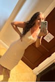 I loved this dress!!! I'm usually a size small and wish I ordered a medium. The bottom is a little light with no give making it sometimes hard to walk and it was a little tight in my stomach area. I'm typically a small and if I wasn't in a rush when I ordered this I probably would've exchanged to see if it had any better of a fit. I'm sure if I had a flat stomach it would've been fine but I think I'm an "Apple" shape and it simply wasn't flattering. Super cute, I wore it out to dinner rather than as a cover up. Great material. - Raelene S.