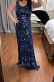 This dress that's great. It runs true to size. It is a little long. I will have to him it. I will be wearing this to my son's wedding. Absolutely beautiful in person. - TRACIE L.
