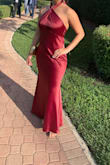 The dress is gorgeous! I had to get it hemmed because it was little long on me, it does have a little train but I cut it off so I don't trip since I'm clumsy. The material was wonderful, felt great on the skin. I would recommend getting the dress dry cleaned or an intense steam to avoid wrinkles. The back is gorgeous. I took a chance getting this dress since there were zero photos or review of customers and I'm glad I took that chance. I received so many compliments. - Oceana C.