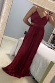 So pretty! Lots of room in the bust, adjustable straps, waist hits at a very flattering point. The only downside is the dress was very long on me and had to be hemmed even with heels - I am 5'2"-5'3" though so I'm used to it. The color is a little bit deeper of a red than it appears in the website picture. - Brooklyn M.