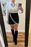 This skirt was true to size, made incredibly well, with a silky-ish material and lined well. Looks exactly like the picture. With rhinestones, it's easy for clothing to look cheap, but the quality was great! I highly recommend. - Jessica C.