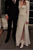 I bought this for my elopement. It was a little bit tight at the ribs but would much prefer that over loose. I had to take 3inches off the bottom and a tiny bit off the sleeves. Overall, I was very happy with the purchase. It was exactly the dress I was looking for! - Cindy P.
