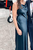 Hands down my favorite dress from Lulus. The material is a beautiful color that fluctuates between navy and teal. The slit is classy. The neckline is classic. It hugs you in the right places. It is a little bit thin in terms of warmth against cold weather, it's not see through but the wind cuts through it.  I would buy time and time again - Ashlynne R.