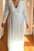 The quality and design of this dress is beautiful but unfortunately it did not flatter my body type. I am pp and I still look pregnant and wide in this dress. The arms were to loose and big on me. The back is gorgeous but was a little loose and wasn't fitted and it showed my back rolls a little too much. - Gizelle P.