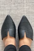 The leather pattern is not exactly as pictured or not as shiny as the website pic. It's OK - Veena W.