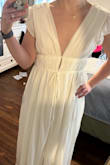 I ordered this thinking I finally found the perfect dress for my bridal shower. I really liked how low cut the V was, but when I received my dress, the V was much tighter at the bottom than in those from other reviews which to me takes away a lot of the allure of the dress. Will be returning as it's just not what I had hoped for. - Katie O.