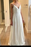 Fits perfectly! I'm tall and will wear flats and it doesn't need to be adjusted at all. The only negative part is the pockets, they are see-through but seem like it would be easy to remove - Sage D.