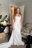 I ended up returning this one, but it is nice quality and really pretty! I love the lace-up back. The train seemed a little weird to me and almost tail-like, lol. The material is pretty stiff and was uncomfortable and difficult to move in. I am 5'3" and it would definitely need to be hemmed. - Carlie W.