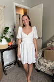 I am normally a size small, but I am super happy I got an XS. It fits me well and is super cute - love the cross-over in the front and the puff sleeves. The shoulder part is a little big and a boob would definitely pop out without fabric tape to secure it. But with some tape, it will be perfect and I can't wait to wear it! Very flattering - Carlie W.