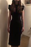 This dress is charming and fits great. A must have for every closet. I love the open back, it's flirty but not too much. Great materials feels expensive. - Michele D.