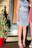 The dress fit my daughter beautifully BUT we had to have it hemmed because she's petite and we didn't love how long it was on her. The only complaint we have is that the dress is not baby blue at all, it's more of a very dusty blue, maybe like a periwinkle? It still looked lovely but we would've preferred the color in the model's pictures. - Kirsten L.