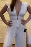 This was exactly what I was looking for! It is so flattering. The lining can get bunched a little and will need to be steamed but helps it not be see-through. It is a bit long and will need to be hemmed but I have learned to expect that from any Lulus jumpsuit. I will also need specific chest tape and maybe some clothing tape to help secure it even more.  I would not feel comfortable wearing it without a bra as I plan to be moving around, dancing, and giving hugs at various bridal events- the girls would certainly pop out if not secured. - Genevieve F.