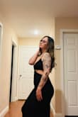 I have the black and the brown one. The black fits a tad bigger than the brown,  but I wouldn't size down. The length, the fit, the material is perfect! Nice weight to the material, not see through. Please bring back the cream or make it in white! - Angela L.