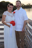 My fiancée and I eloped on New Year's Eve at the park. This dress is absolutely beautiful. It fits perfectly. - Gloria M.