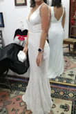 I loved this dress! I wanted simple but elegant, and the dress provided just that. It was very comfortable and I was able to dance all night. It needed slight alterations, mainly to shorten it  and slightly adjust the shoulders. - Maria F.