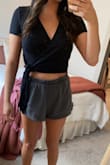 This is a super cute top! Very comfortable and not too cropped, love that you can re-tie it to make it tighter or looser - Emily P.