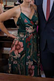 Really pleased with how this dress turned out. Dark green version was lighter pink and red (rather than the almost hot pink I see in the website photo), which I was happy with. I  had it hemmed (I am 5'8" and wore flats, but it would have required hemming even with heels). Unfortunately, because of the volume of fabric and the texture of the fabric, it cost me more to alter it than the original purchase price! I also added a quick stitch at the bust to hold it together for modesty but didn't wind up having to wear a bra. Received many compliments. Also, love that I was able to wash it on "hand wash" cycle and hang it to dry instead of dry cleaning it. Probably could have ordered a size down since it is not tight in the hips at all, but it wasn't worth exchanging. - Alexis N.