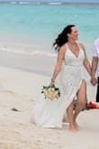 I was skeptical buying a wedding dress online but I'm so happy I did. Fit was true to size. I purchased a medium. The fabric was nice and not cheap. I did have to have the straps altered as they were too big. Adjustable ones out of been perfect. I also had bra cups put in for a smoother look and I wasn't a big fan of the edge bits of lace on the chest area so I had them trimmed off. But kept them in the leg slit. Absolutely loved the final look. And had tons of compliments - Melissa G.