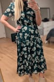Wearing this dress for a baptism. Love the color and pattern! I normally am a medium in Lulu's but I downsized to a size small (after reading other reviews) and it fits great! The waist has a lot of stretch to it so downsizing wasn't an issue. - Allison C.
