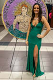 The dress was true to size.  I am 5'5" and it was the perfect length. The material was of great quality with the right amount of stretch. No alterations were made to the dress.  Great color and was perfect for the Mardi Gras ball. - Lynsie S.