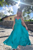 I wore this to a destination wedding in the Dominican Republic on a mountain top and it was PERFECT. So flowy, so beautiful in the wind. I find that most of Lulus dresses run a bit big, so I almost always size down & have them hemmed. The small fit perfectly after hemming. I have a small chest & big hips, for reference. - Kaity A.