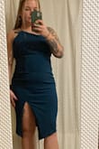 This dress fit perfectly. It's form fitting but not super tight. The open back is so pretty. The only thing is I was hoping it was emerald green but it is wayyyy more of a blue/teal. Definitely not green. - Alexis H.