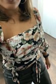 I really like the style of this top! My only issue is that it fits perfectly around my chest and stomach but the sleeves are so loose they fall down off my shoulders. Still, I'll keep wearing it though. I styled it with faux leather pants and black heels and it was cute. - Donna L.