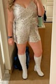 I ordered this romper for a 70's disco-themed birthday party and it was an absolute hit! I have long legs and a full chest, and I didn't feel this was too short or exposed too much of my chest. It's definitely booby, don't get me wrong, but it was at a level I was comfortable with. I typically wear a 12 or 14 in dresses, and I ordered an XL in the romper and it was perfect.
Two things to consider when you're ordering are:
1. If your thighs touch while walking, some of the sequins will tug and fall off.
2. I'm fair with somewhat sensitive skin. The sequins rubbed my inner thighs and the insides of my arms, so I ended up with a little rash on my arms and thighs. Honestly, for one night I was fine with it, but it's something worth noting if you have sensitive skin or have sensitivities to certain textures/fabrics. - Kate P.